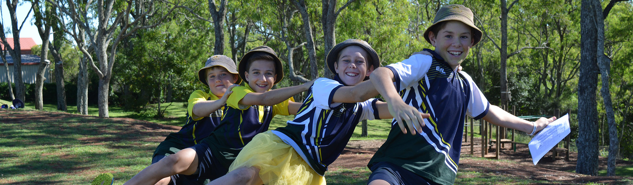 Fairview Heights State School students holding each other's shoulders and laughing